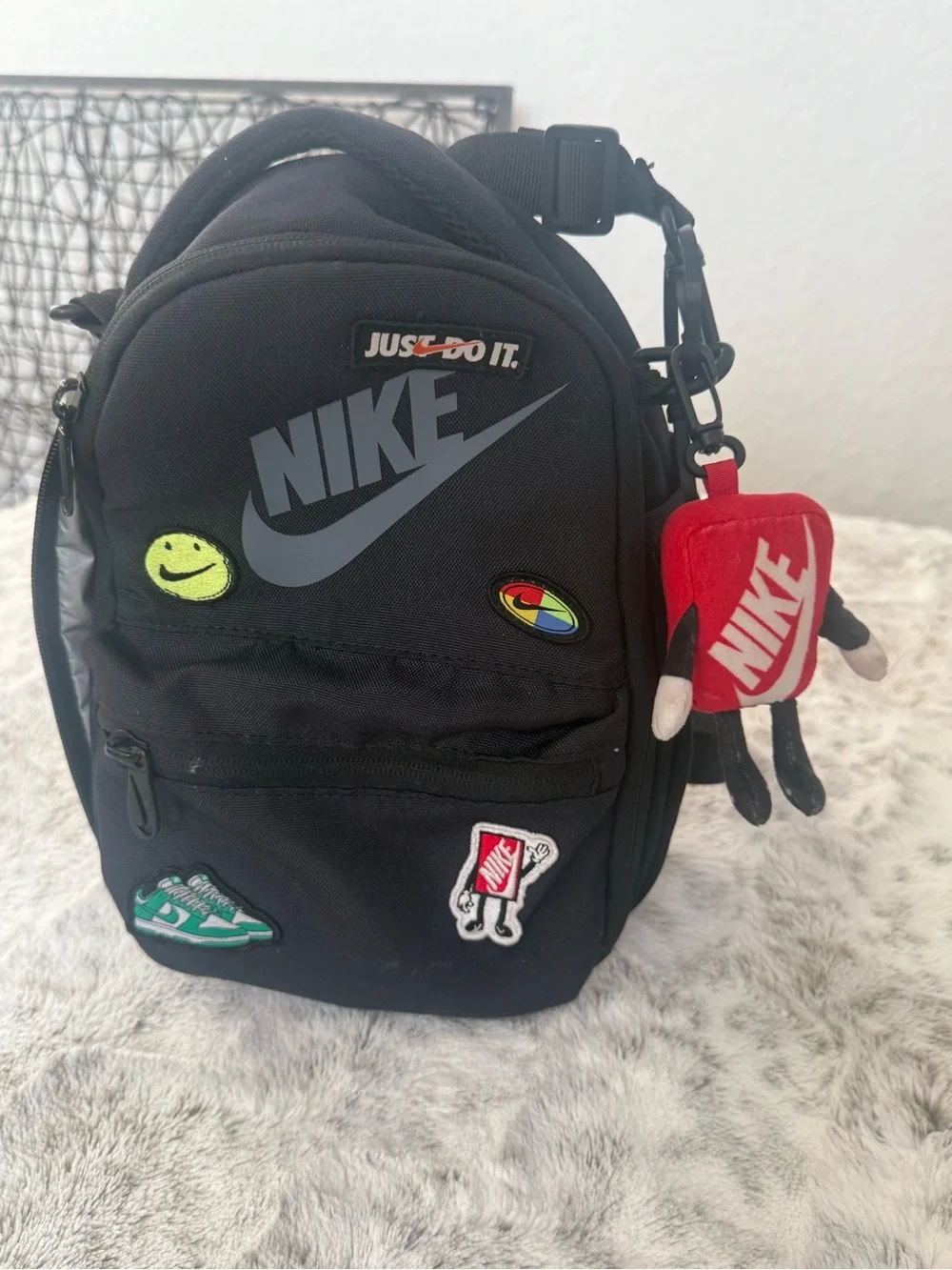 Nike Black Mini Backpack with Red Branded Charm and Colorful Patches